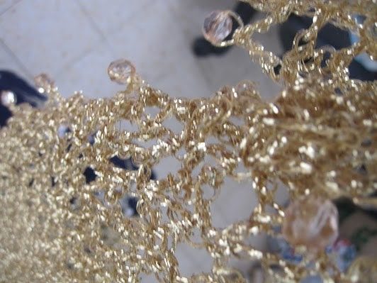 Close-up of the champagne shawl's beaded edge, clear beads set along the scalloped trim.