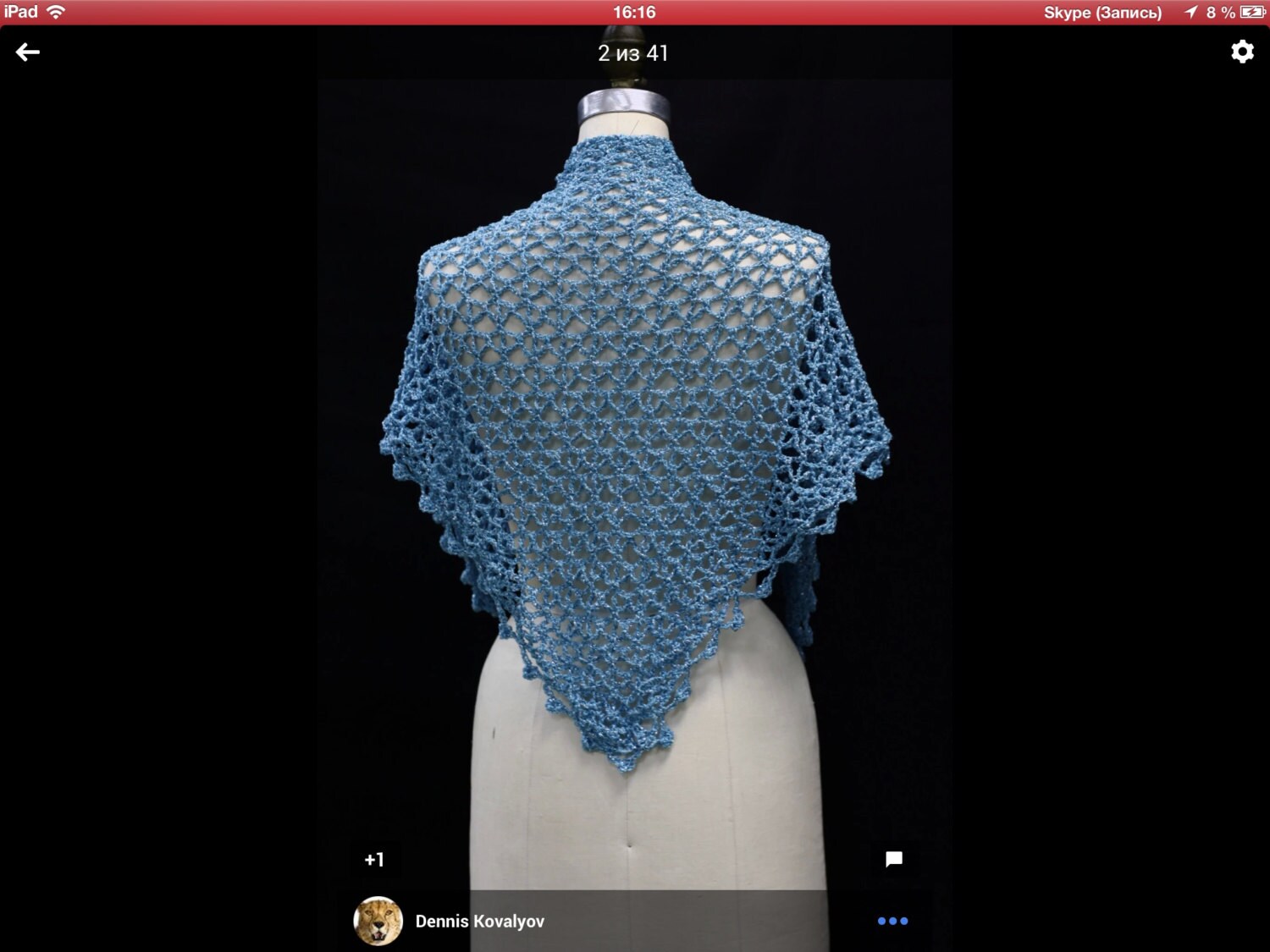 Back view of the light blue shawl on a mannequin, showing the full triangular drape down the back.