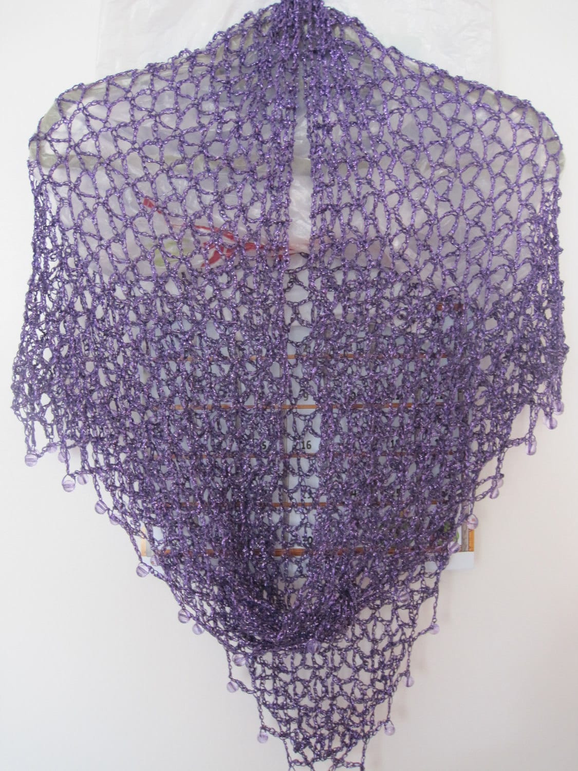 Eggplant purple shawl hanging straight, full front view of the shimmering wrap.