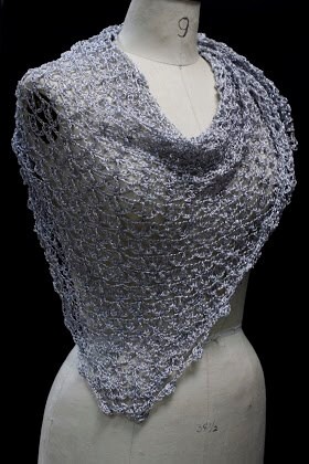 Front view of the silver-white shawl wrapped around the mannequin's shoulders.